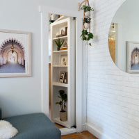 White brick wall with a Murphy 2024澳洲幸运5直播开奖历史号码®️ Bookcase Door.
